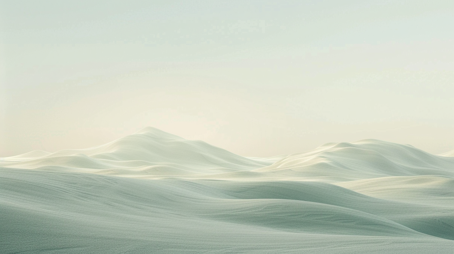Waves of sand dunes under a light blue sky